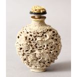 A GOOD 19TH / 20TH CENTURY CHINESE MONOCHROME PORCELAIN SNUFF BOTTLE, depicting lion dogs amongst