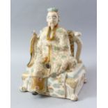 A LARGE JAPANESE MEIJI PERIOD SATSUMA FIGURE OF A SEATED DEITY, the figure seated upon a half