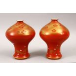 AN UNUSUAL PAIR OF JAPANESE MEIJI PERIOD CORAL RED FUKAGAWA PORCELAIN VASES, the unusual vases