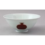 AN EARLY 20TH CENTURY CHINESE UNDERGLAZE RED PORCELAIN BOWL, the bowl decorated with peach fruits,