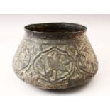 A 19TH CENTURY OR EARLIER PERSIAN TINNED COPPER BOWL, with carved embossed decoration depicting