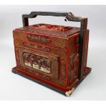 A GOOD CHINESE LACQUERED BOX & COVER WITH MOULDED HANDLE, the box with carved panels in canton style