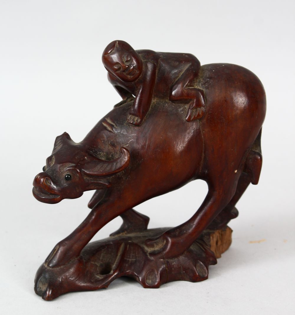 A 19TH CENTURY CHINESE CARVED CHERRYWOOD FIGURE OF AN OXEN & BOY, the boy riding upon the back of - Image 2 of 8