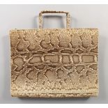 A LARGE SNAKESKIN BAG.