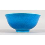 A CHINESE BLUE GROUND CIRCULAR BOWL, the sides etched with dragons. Six character mark. 6ins