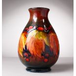 A GOOD LARGE MOORCROFT POTTERY VASE, "Leaves and Berries". W. Moorcroft signature and impressed W.