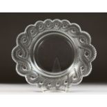 A HEAVY CIRCULAR LALIQUE DISH, with scalloped sides. Etched LALIQUE, FRANCE. 11ins diameter.