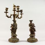 A PAIR OF 19TH CENTURY FIGURAL BRONZE CANDLESTICKS, with classical figures and three sconces.