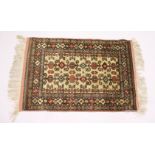 A NORTH EAST PERSIAN SARKHAS SILK RUG, beige ground with Caucasian Perdidil design. 5ft 9ins x 3ft