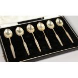 A SET OF SIX STERLING SILVER COFFEE SPOONS, cased.