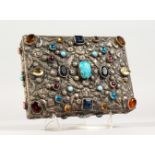 A GOOD INDIAN RECTANGULAR SILVER BOX AND COVER inset with coloured stones, 16cm long x 11.5cm deep x