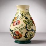 A MOORCROFT POTTERY VASE, "Holly Berries". Signed J. Moorcroft, 19.11.96. 5.5ins high.