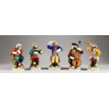 A SET OF FIVE DRESDEN PORCELAIN MONKEY BAND FIGURES, including The Conductor. 5.5ins high.