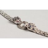 A SILVER SAPPHIRE SET PANTHER BRACELET.