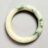 A PALE JADE BANGLE.