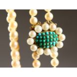 A GOOD TWO-ROW STRING OF PEARLS, with pearl and enamel clasp.