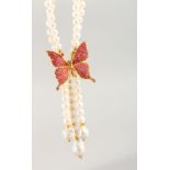 A PEARL RUBY SET BUTTERFLY NECKLACE.