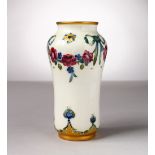 A MOORCROFT POTTERY MACINTYRE VASE, garland of roses and ribbons. Script signature W. Moorcroft in