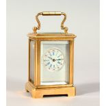 A MINIATURE BRASS CLOCK. 2.5ins.