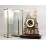 A LARGE BRASS CATHEDRAL SKELETON CLOCK, with fusee movement, in a glass dome on a marble base. 22ins