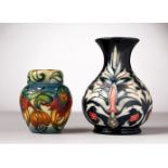 A MOORCROFT POTTERY VASE and A GINGER JAR AND COVER. 6.5ins and 4.5ins high.