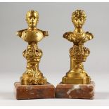 CORDIER, a pair of small cast gilt bronze busts of a military man and a woman, on marble bases. 5.