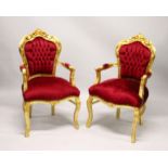 A PAIR OF GILT FRAMED FRENCH STYLE ARMCHAIRS.