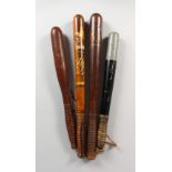 TWO VICTORIAN TRUNCHEONS, and two others. (4) 15.5ins - 18.5ins long.