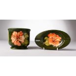 A W. MOORCROFT GREEN GROUND ASHTRAY, Printed Label, 6.25ins long, and A JARDINIERE, 4ins