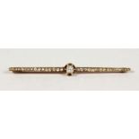 A GOLD DIAMOND SET BAR BROOCH.