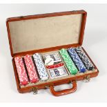 A GOOD LEATHER CASED POKER SET.
