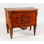 AN APPRENTICE FRENCH INLAID TWO DRAWER COMMODE, with crossbanded parquetry top, floral oval to the