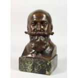 J. RISPAL A BRONZE BUST of a man with handlebar moustache and beard. Signed. 7ins high, on a