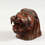 A CARVED WOOD LION'S HEAD TOBACCO JAR, modern. 7ins long.