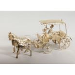 A WHITE METAL MODEL OF A COACH AND HORSES. 9.5ins long.