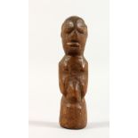 A CARVED OAK EASTER ISLAND FIGURE. 6.5ins high.