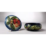 A MOORCROFT POTTERY CIRCULAR POWDER BOWL AND COVER, 99. 6ins diameter.