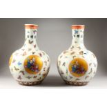 A LARGE PAIR OF CHINESE PORCELAIN BULBOUS VASES, painted with figures and butterflies. 21ins high.