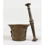 A SMALL CAST BRONZE PESTLE AND MORTAR, with side flanges. 2.75ins high.