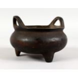 A CHINESE BRONZE CIRCULAR CENSER with leopard handles. Impressed mark. 4.5ins diameter.