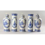 A DUTCH DELFT FIVE PIECE GARNITURE, comprising three baluster shaped vases and covers, and a pair of