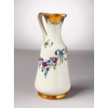 A MOORCROFT POTTERY MACINTYRE JUG, No. 2528, white ground, gilt ground with forget-me-nots. Script