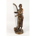 GEORGE CHARLES COUDRAY (1883-1932) FRENCH A SUPERB BRONZE OF A YOUNG LADY with a harp, on a circular