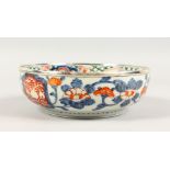 AN IMARI CIRCULAR PORCELAIN BOWL, with silver rim. 8.5ins diameter.