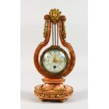 A GOOD SMALL LOUIS XVI DESIGN PINK MARBLE AND GILT LYRE CLOCK, with painted face, bead work and