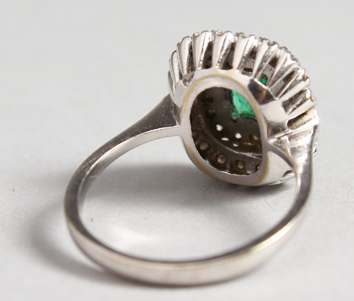 AN 18CT WHITE GOLD, DIAMOND AND EMERALD CLUSTER RING. - Image 2 of 3