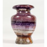 A TURNED BLUE JOHN URN. 6ins high.