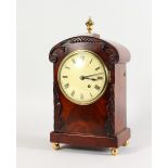 A 19TH CENTURY MAHOGANY CASED BRACKET CLOCK by RUSSELL OF LONDON, CIRCA. 1820, the case carved