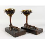 ANTHONY REDMILE (Born 1937) CREATIVE DESIGNER A PAIR OF CIRCULAR COCONUT CUPS ON CLAW BASES. 9.