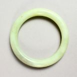 A PALE JADE BANGLE.